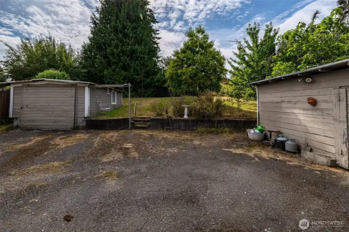 PArking area and back yard facing alley way (west)