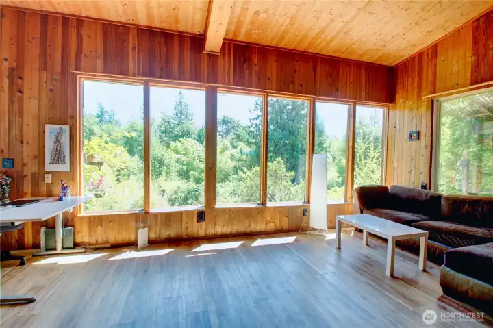 Enjoy nature views from within the bright living space of the cabin
