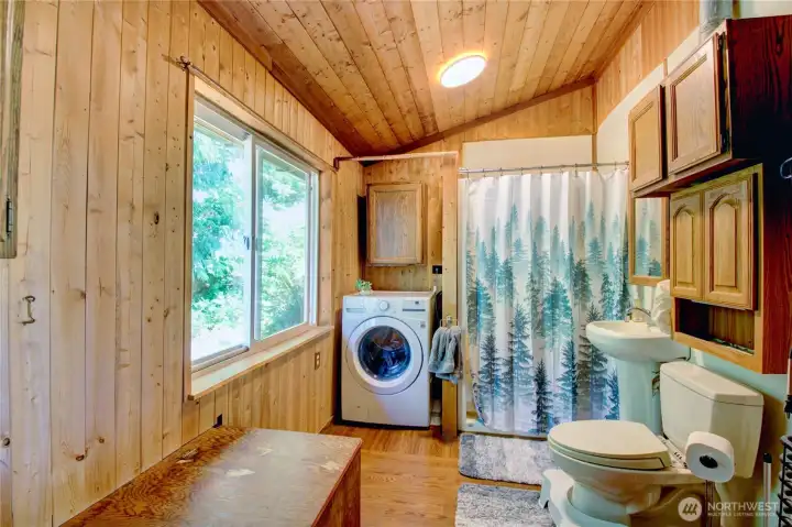 3/4 bathroom with washer.