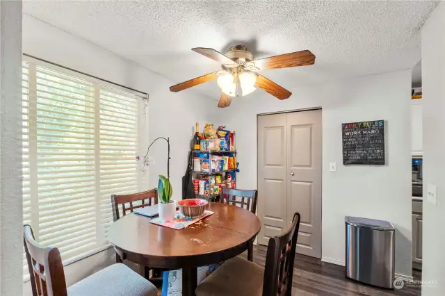 The dining area fits your table comfortably.  Through the double doors is the laundry room.
