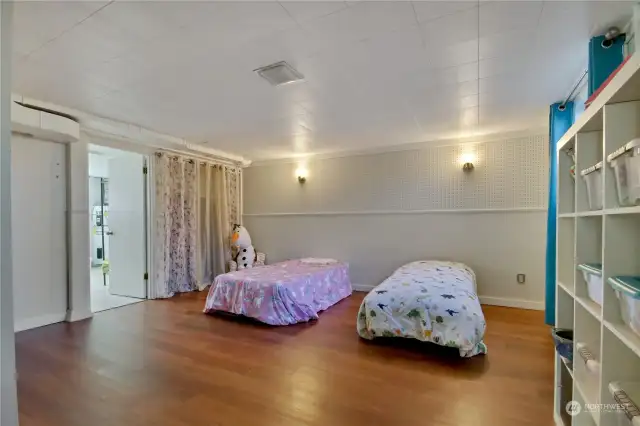 Huge playroom currently shown as a potential extra bedroom or ???