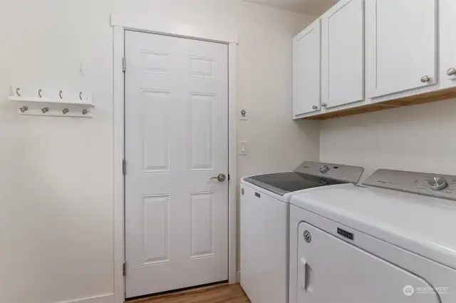 Laundry is located between the kitchen and entry to the garage. The Maytag washer and dryer stay with the sale.