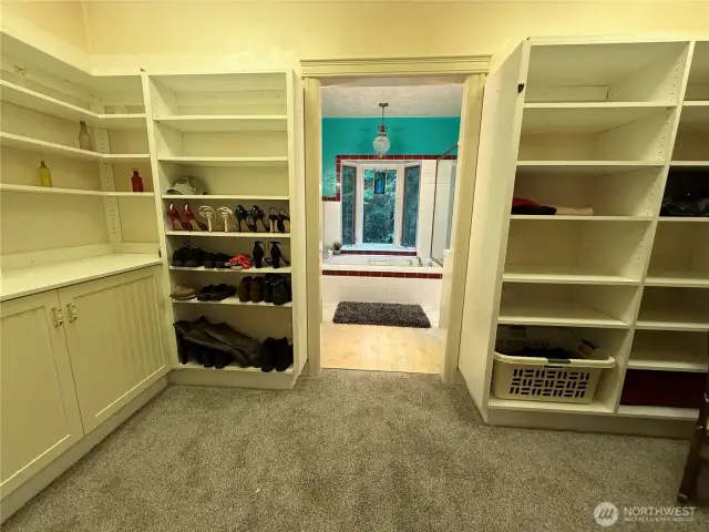 Wow! Large walk-in closet w/ tons of space leads into primary bedroom ensuite.