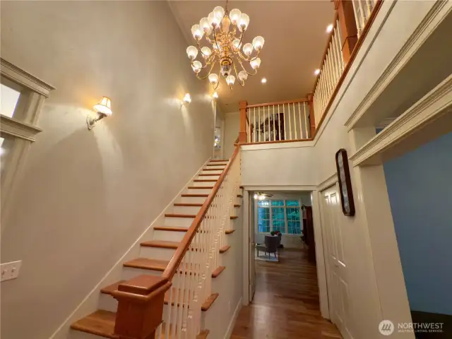 Gorgeous staircase and chandelier leading to 2nd floor!
