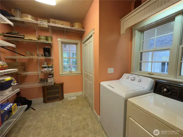 Large walk-in pantry w/ tons of storage and washer and dryer.