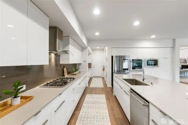 Gourmet Chef's dream kitchen. High end appliances include an eye level oven and a computerized refrigerator.
