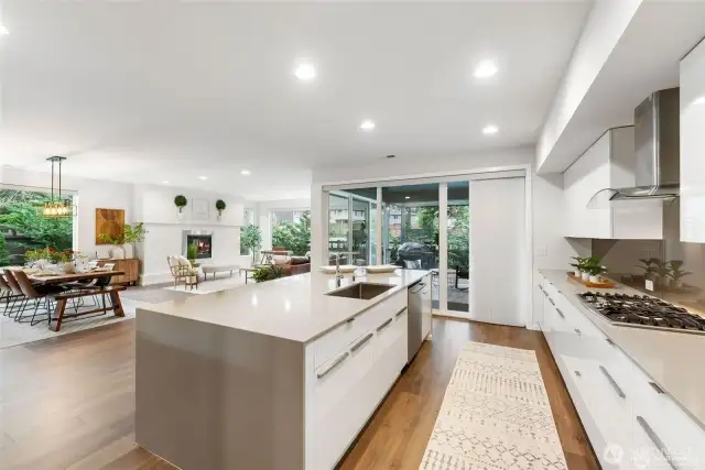 The Chef's kitchen is a culinary masterpiece, featuring high-end stainless steel appliances, quartz countertops, and a generous center island with bar seating. at its best.