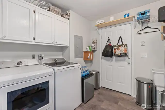 Spacious utility/mud room with plenty of storage