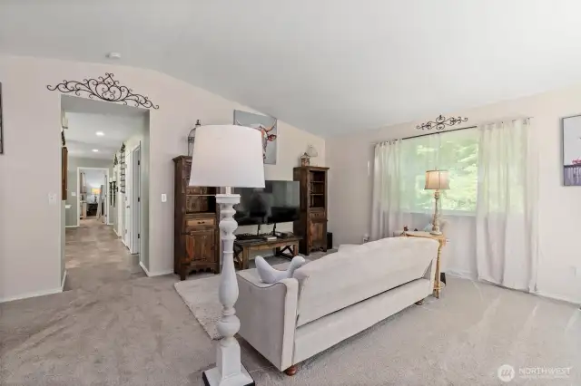 Upon entering, you are greeted by a spacious living room