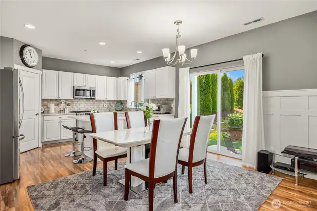 Dining room is ideal for entertaining and features a slider to backyard covered patio