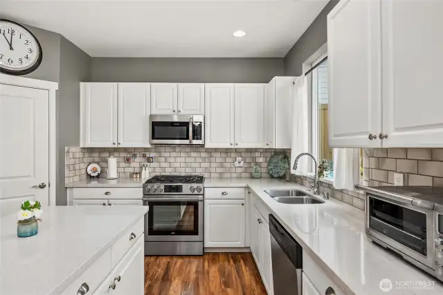 Kitchen is spacious and features a walk-in pantry
