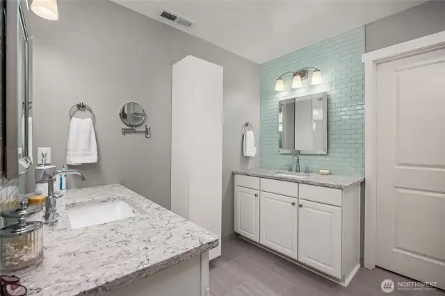 Primary bathroom offers great storage and is inviting