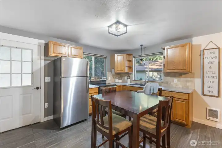 Corner kitchen with lots of natural light from the large windows.