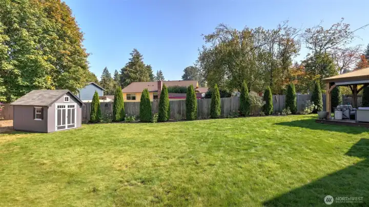 This spacious. fully fenced yard offers mature landscaping for maximum privacy.