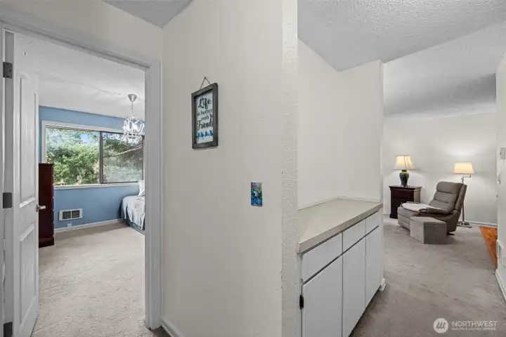 The hallway has a built-in buffet for extra storage and workspace.