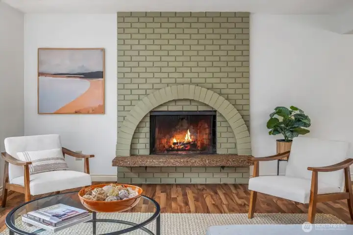 Cozy up to the wood-burning fireplace that has architectural appeal and is a statement piece.