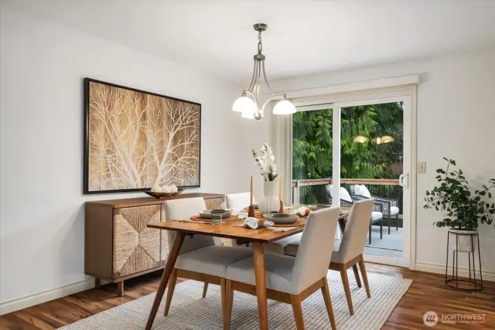 Formal dining room is flooded with natural light and opens out onto upper-level deck overlooking the backyard for outdoor dining options!