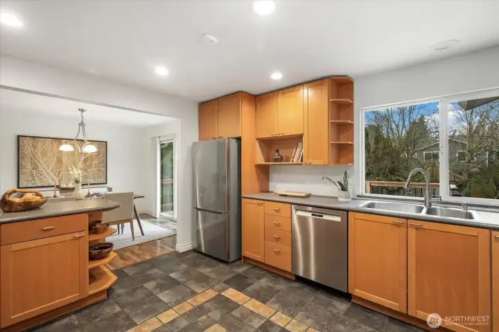 You'll love prepping your meals in the light and bright kitchen while overlooking the lush backyard and green views.