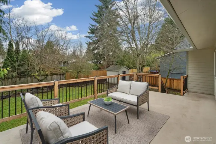 Beautiful, spacious back deck that overlooks the large, flat backyard! Abundance of green views and privacy (especially as the leaves come back)!