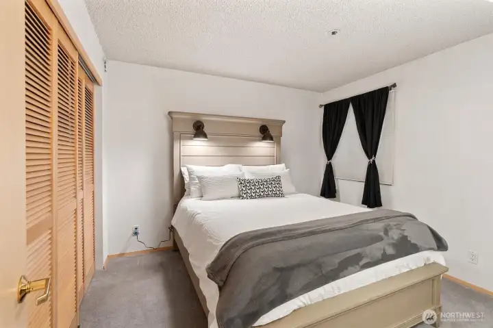 The guest room is ideally situated at the back of the unit, offering a well-designed split floor plan that ensures privacy and a quiet retreat for visitors.