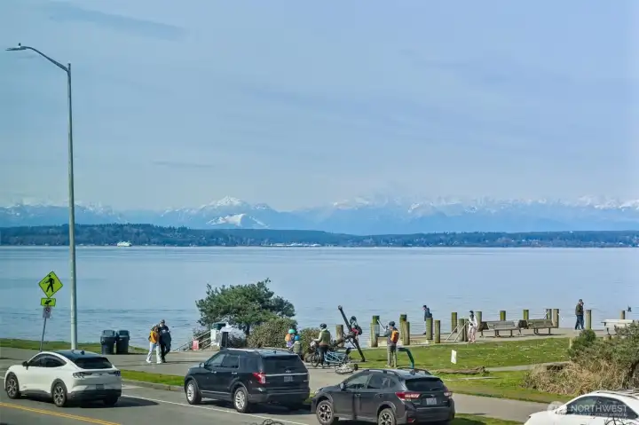 Savor breathtaking views of the snow-dusted Olympic Mountains and immerse yourself in the vibrant hues of unforgettable sunsets—all from the comfort of your new home on Alki Beach.