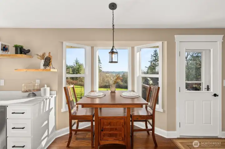 Eating nook off of the kitchen with access to the back deck
