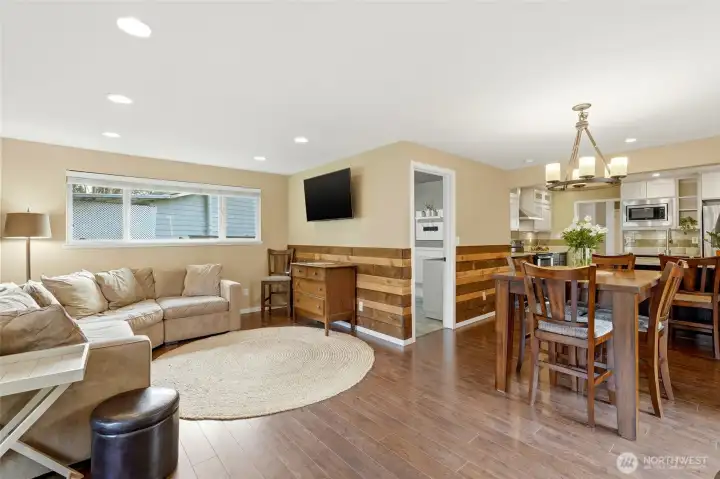 The dining room connects the kitchen and the family room.