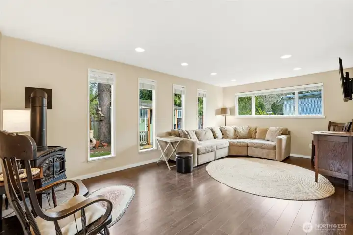 Oversized family room with windows on three different walls.
