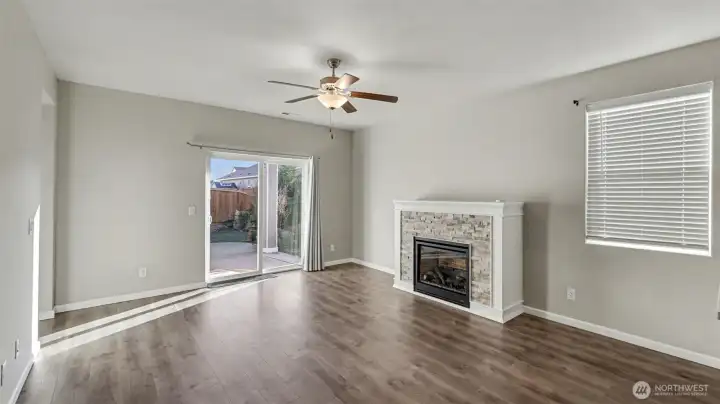 Spacious and light-filled family room with direct access to the backyard patio, ideal for indoor/outdoor living and entertaining.