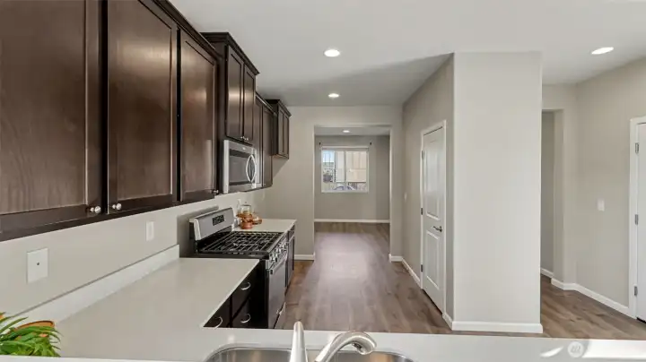 Spacious kitchen with ample quartz counter space—ideal for meal prep, entertaining, and casual dining.