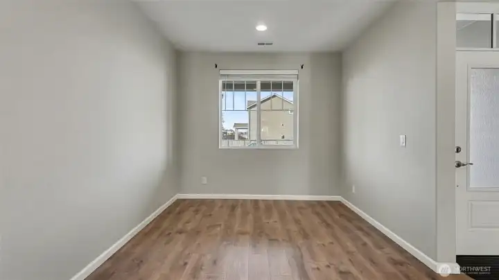Just inside the front door, the formal dining room sits to the right, offering a welcoming and defined space for hosting and special occasions.