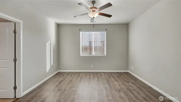 Spacious primary bedroom offering plenty of room for a king-size bed and additional furnishings.