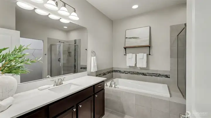 Spa-like primary bath featuring a luxurious soaking tub—perfect for unwinding at the end of the day.