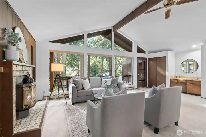 Comfortable living space centered around a cozy fireplace.