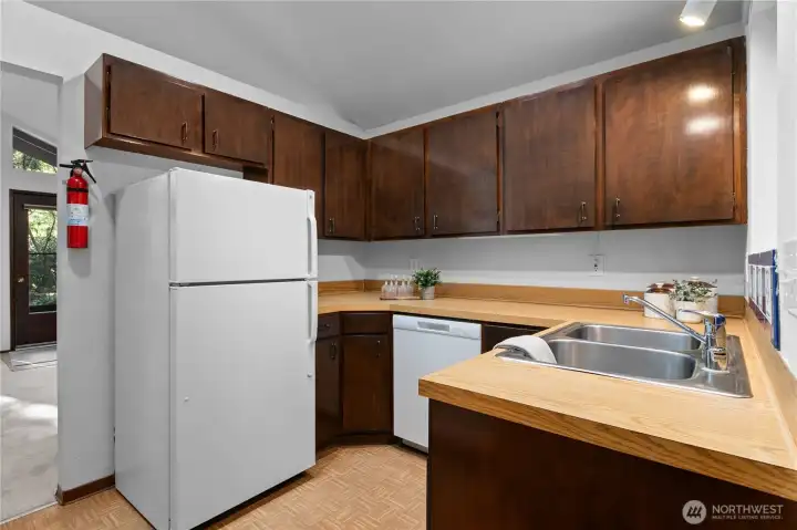 Functional kitchen with ample cabinetry and workspace.