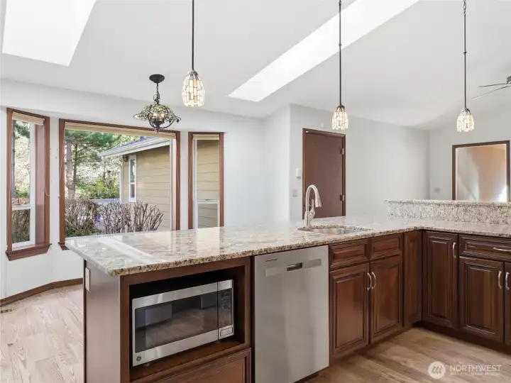 KITCHEN - Eating Area, then outside views byond. Garage to the right and Bonus Rm