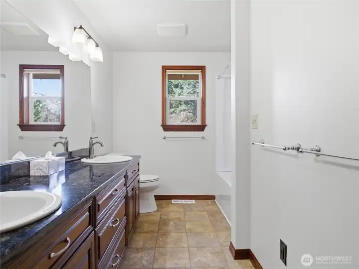 BATHROOM #2 - Granite Counter w two Sinks. New Tub/Shower on right.