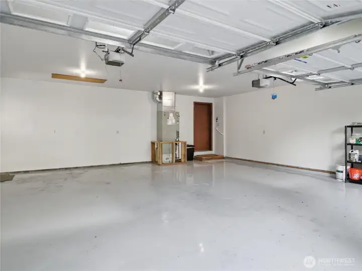2 CAR GARAGE - Epoxy Flooring, new Paint. Door to Family Rm.