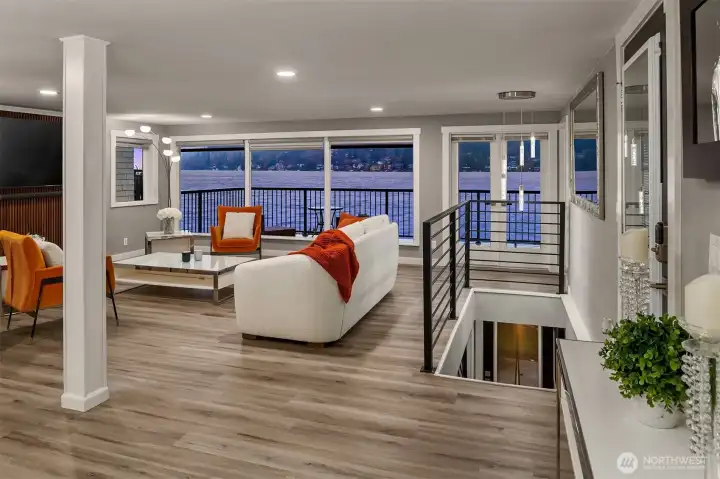 Main level features the open kitchen and living spaces, one bedroom, 3/4 bathroom and office/den.