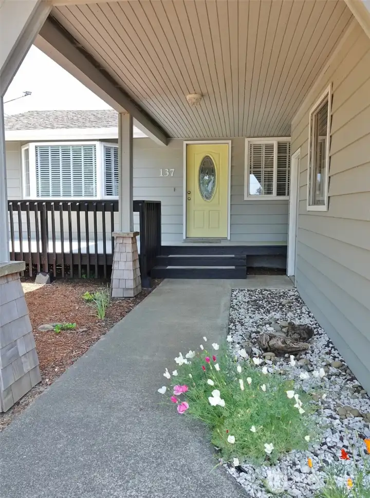 Covered Walkway leads to the Entry and Garage.