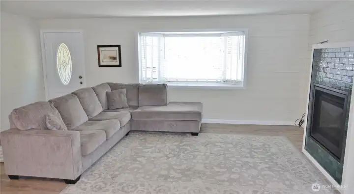 Enter into this nicely re-done home w/ LVP flooring and Propane Fireplace.