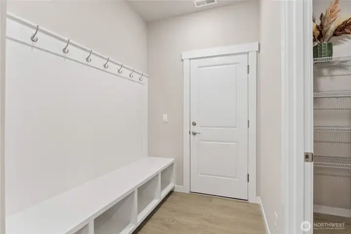 Mud room located off the garage, adjacent to the spacious pantry.
