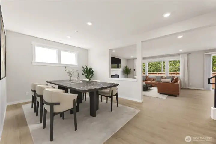 Formal dining adjacent to the great room, virtually staged.