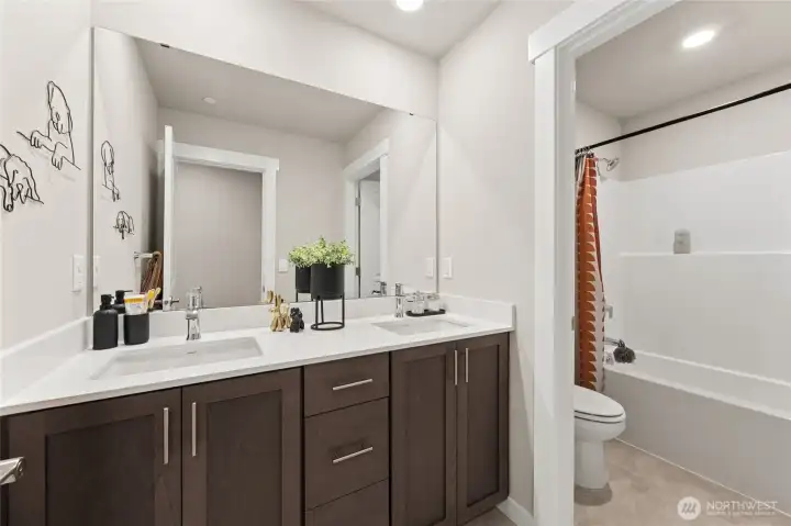 Upstairs bath, vanity with dual sinks.