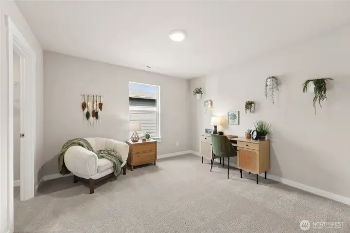 Stylish multi-use room offering a polished space for work or relaxation.