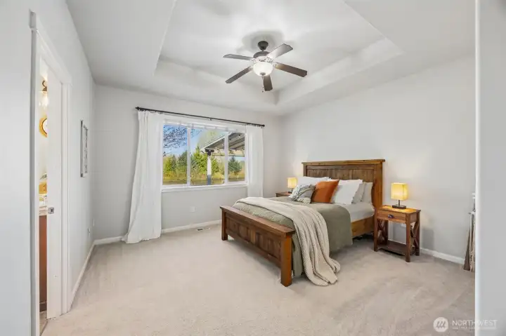 Overlooking the serene pond & backyard oasis.