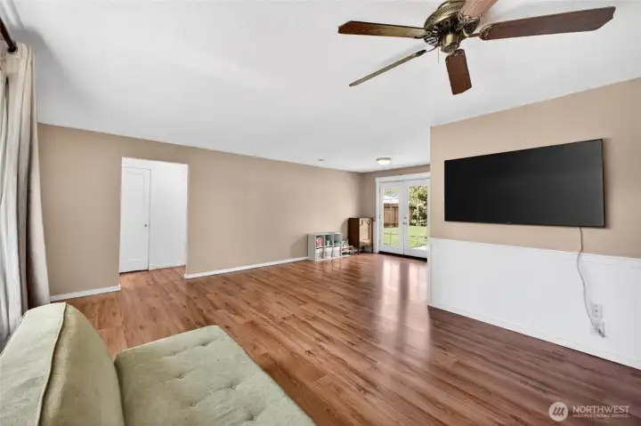 Another family room view looking toward dining room and back yard through french doors