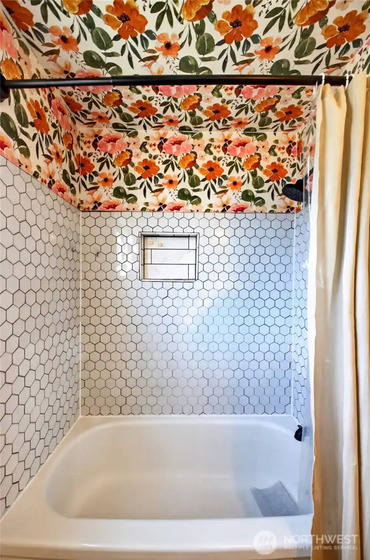 Cheery main bath for bathing and showers with colorful backsplash
