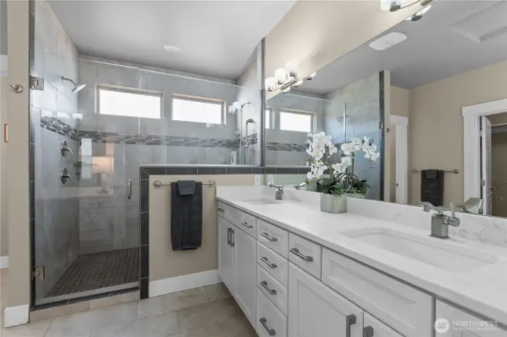 Fully Tiled, Two Headed Shower with Frameless Glass Surround