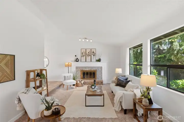 Upon entry, the bright and inviting living room will greet you.